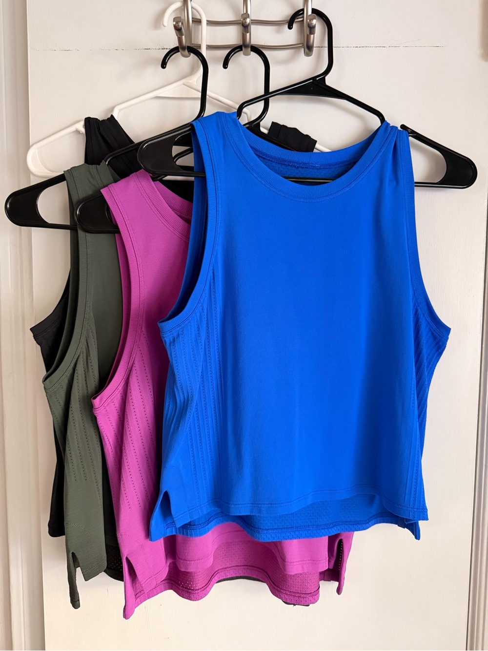 Lot of 4 lululemon waist length tanks
